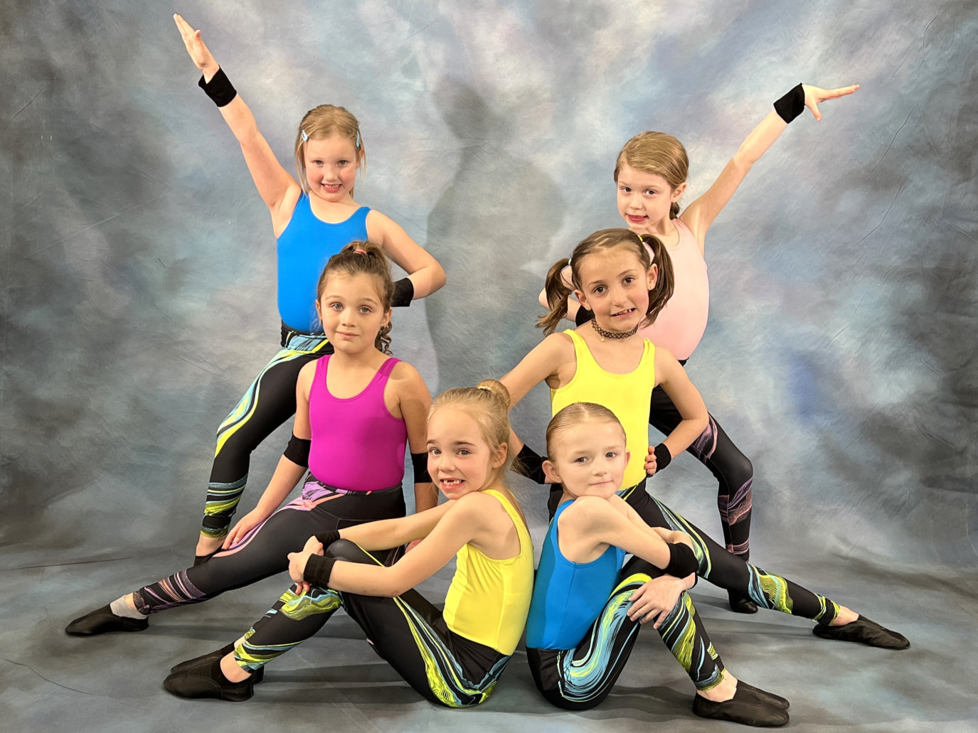 Girl is colorful acro outfits group portrait